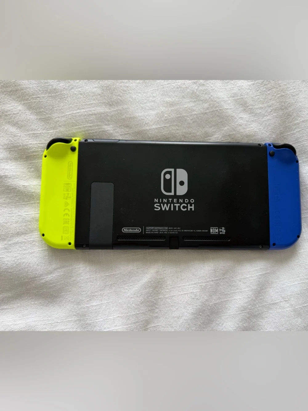 Nintendo Switch with Neon Blue & Neon Yellow Joy-Con and Yellow Carry Case